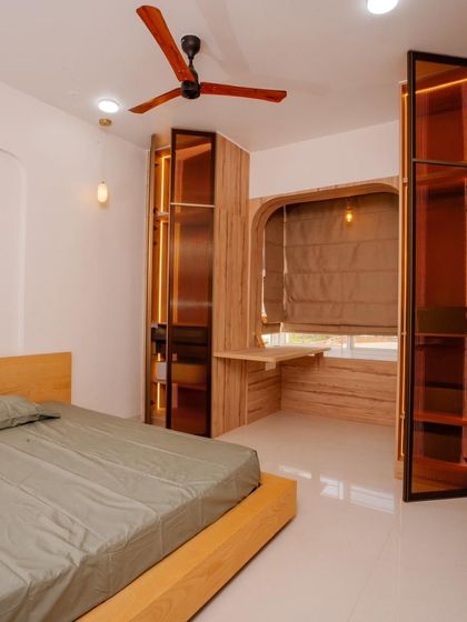 Another bedroom from the Mana Capitol project, this one with a fluted glass wardrobe and an integrated study nook, blending aesthetics with practicality.