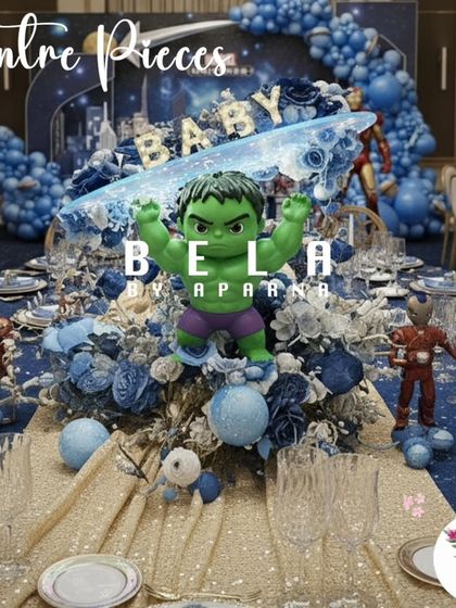 Another powerful centerpiece option, this one featuring the Hulk. The arrangement uses blue florals and a 'BABY' sign, making it a fun and thematic choice for a first birthday celebration within the Marvel universe.