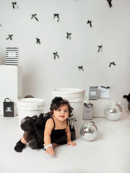 The little one is on the move, crawling past the Chanel-themed props and disco balls. Even the action shots are stylish.