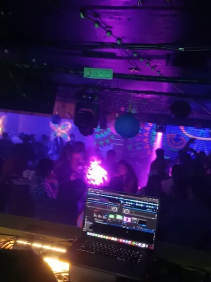 My laptop in the foreground, the packed dance floor in the back. This is my command center for controlling the night's energy.