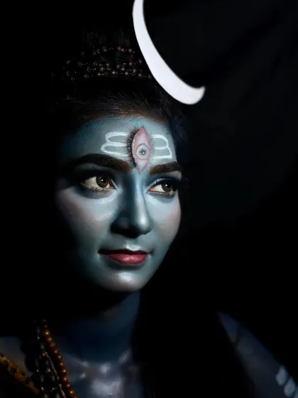This is my artistic tribute to Lord Shiva, created using professional body paint and dramatic lighting. The look focuses on capturing a divine essence, complete with the iconic third eye and crescent moon, perfect for mythological photoshoots or themed events.
