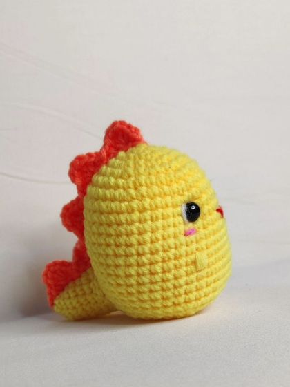 My tiny dino keychains are a handful of cuteness. They come in four different colors: blue, yellow, green, and grey.