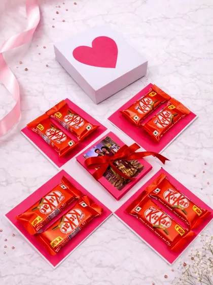 The heart of the surprise. This is my photo explosion box closed, with a simple heart on top, giving no hint of the memories and chocolates packed inside.