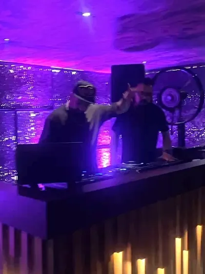 A view of the DJ booth at Kaze, with me and my partner getting the crowd hyped.
