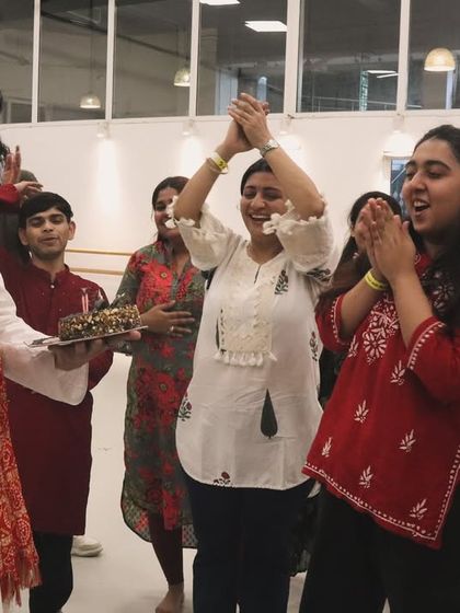 Celebrating my birthday with a cake cutting in the studio, surrounded by the cheers and love of my students.