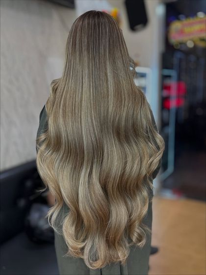 Another view of the Icy Ash blonde look, showing the seamless blend from the darker roots to the icy ends.