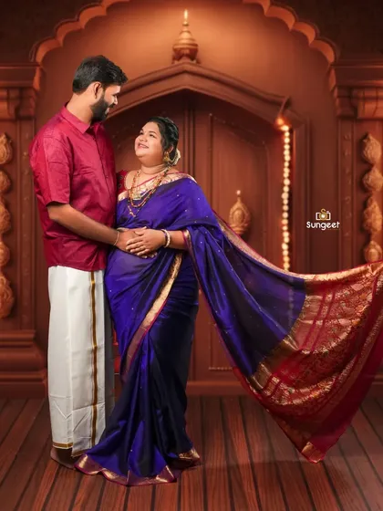 A sweet, interactive pose where the couple shares a look of love and anticipation. The flowing saree adds a dynamic element to the photo.
