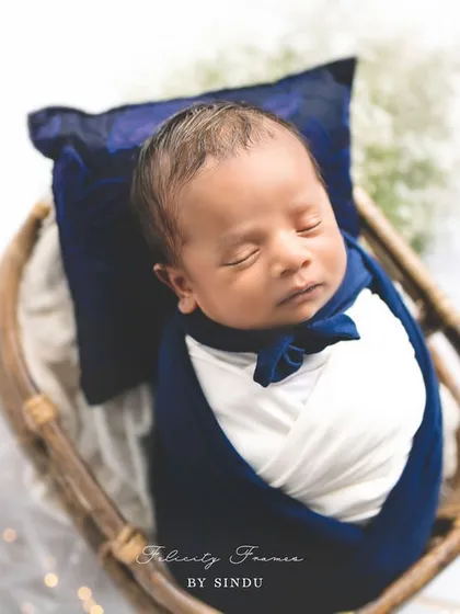 Dressed in his little best. This handsome newborn looks so dapper, swaddled in deep blue with a tiny bow tie. It’s these sweet details that make each newborn session unique.