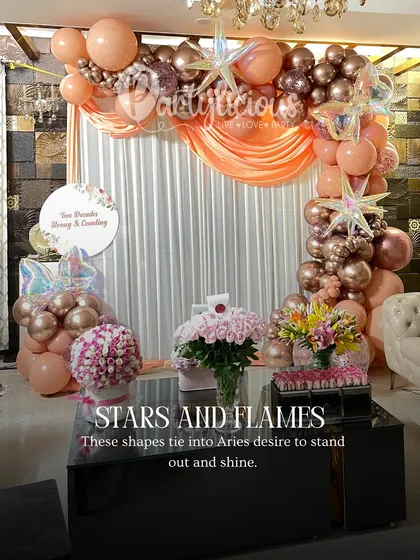 Stars and flames. A glamorous rose gold balloon setup, perfect for an Aries who loves to stand out and shine.