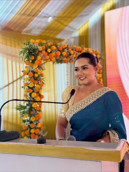 A happy, confident smile from the podium. My positive energy is contagious and helps create a celebratory mood.