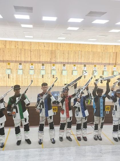 Our shooters with their rifles held high, a symbol of their dedication and readiness to compete at the Khelo India Youth Games.
