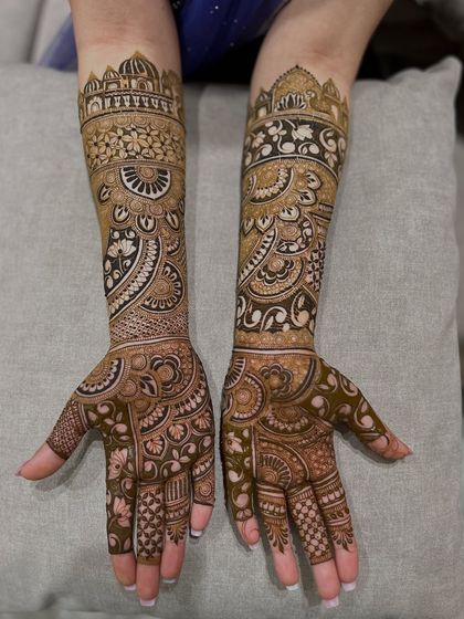 This design features architectural dome motifs on the top, flowing down into intricate paisley and floral patterns.