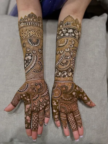 This design features architectural dome motifs on the top, flowing down into intricate paisley and floral patterns.