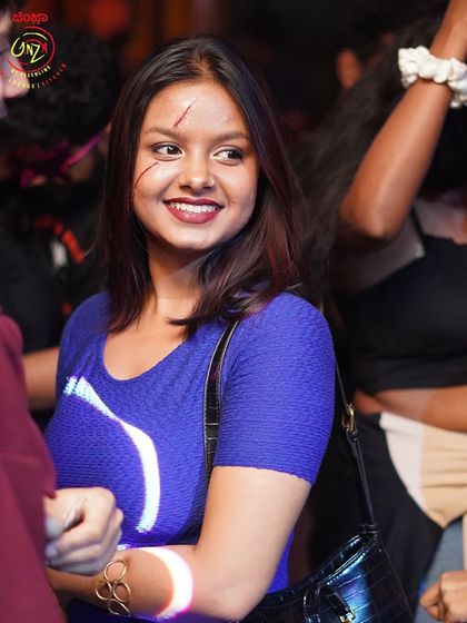 A partygoer with spooky makeup for our Halloween event.