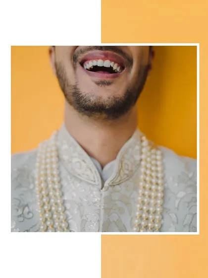A duplicate of 304, another frame capturing the groom's infectious smile.