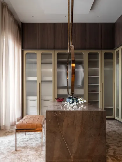 A walk-in wardrobe is more than storage; it is a personal boutique. I designed this 4000 sq. ft. space within a Mumbai apartment to be a haven of style and organization, where every piece has its place and getting ready is an experience in pure luxury.