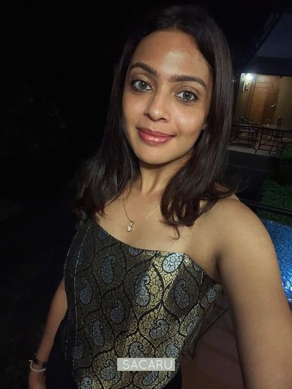A close-up selfie of Bhavani in her custom brocade corset, showing the beautiful texture of the Benaras fabric.
