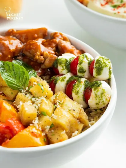 A close-up of the fresh mozzarella and cherry tomato skewers in my Italian bowl, drizzled with pesto. It's all about fresh, quality ingredients.