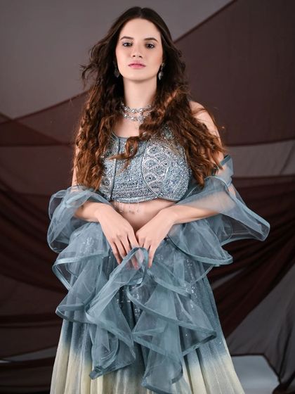 This shot captures the full glamour of the ombre sequin lehenga, a popular rental choice for influencers and makeup artists for its high-fashion appeal.