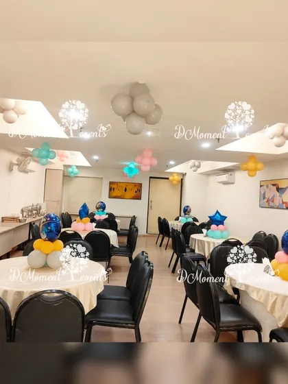 The space theme extends to the guest tables with planet and star-themed centerpieces.