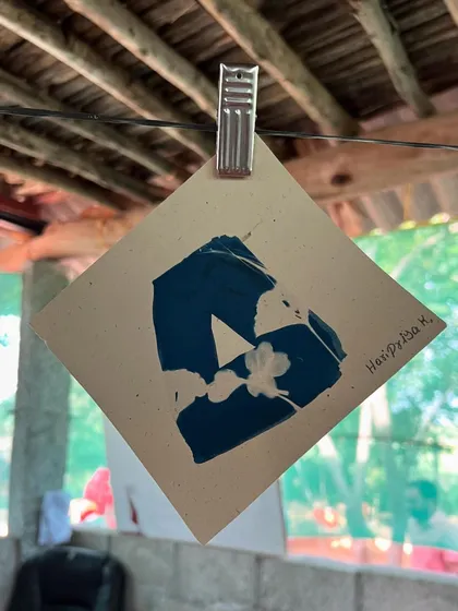 Another imaginative cyanotype created by a young artist at our community workshop. The bold, abstract form against the deep blue background is a wonderful example of experimental art.