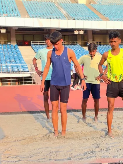 Athletes taking a moment to reset between sand pit drills. This type of training is incredibly demanding, and recovery is just as important as the exercise itself.