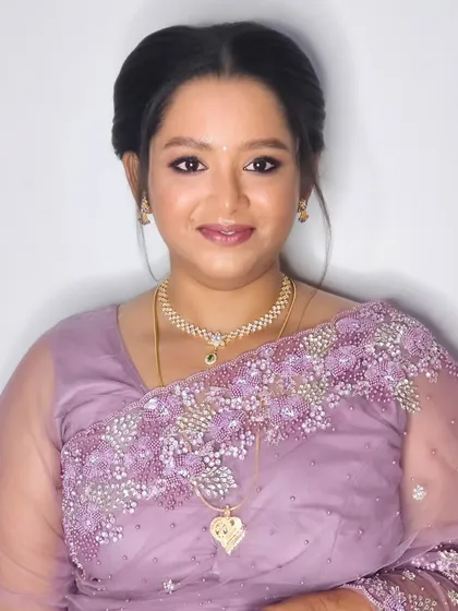 Jebha's reception makeover in a lovely lavender saree. I created a soft, romantic look with a matching eyeshadow and a neat updo to complete her elegant style.