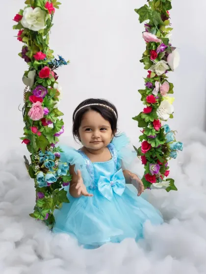 Reaching out for a hug! This one-year-old is full of life and personality in her birthday portraits.