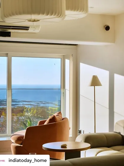 Our 'House on the Hill' project, featured in India Today Home, was designed to embrace the stunning ocean view. This corner, with its comfortable armchair, becomes the perfect spot to watch the sunset over the water.