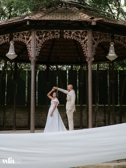A couple shares their first dance inside the historic Colonial Bandstand. This space is designed for grand celebrations, from elegant receptions to lively Sangeet nights.
