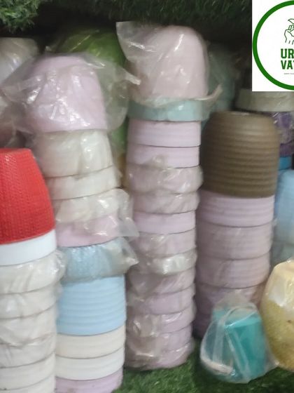 More small, colourful plastic pots.