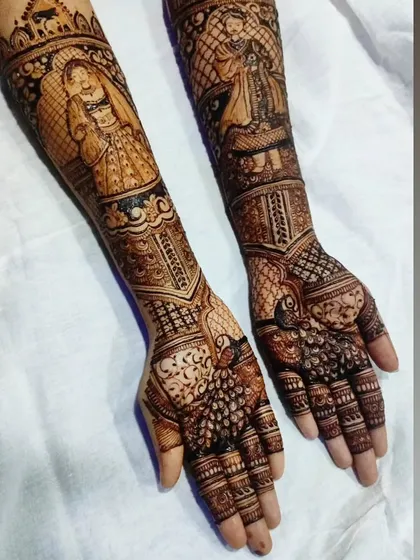 The complete view of the bride and groom portrait henna, a highly sought-after skill for wedding artists.