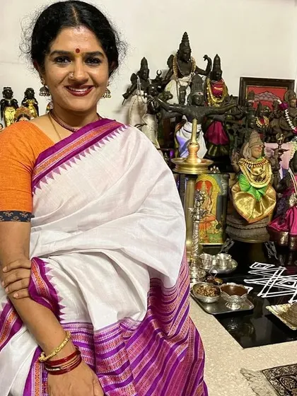 Posing with my home temple during Navaratri. My faith and my art are deeply intertwined, and festivals like these are a time for reflection and gratitude.