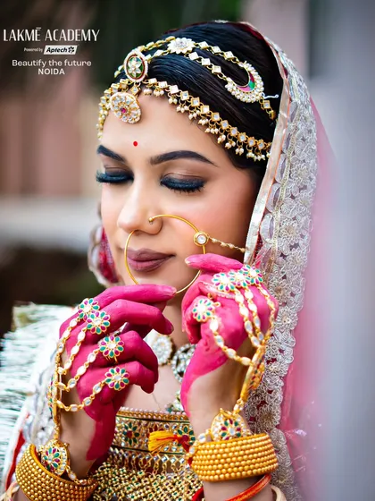 Learn to create majestic Rajasthani bridal looks. This "Banni" makeup showcases the royal traditions of Rajasthan, from the heavy jewelry and vibrant colors to the signature eye makeup that our courses cover in detail.