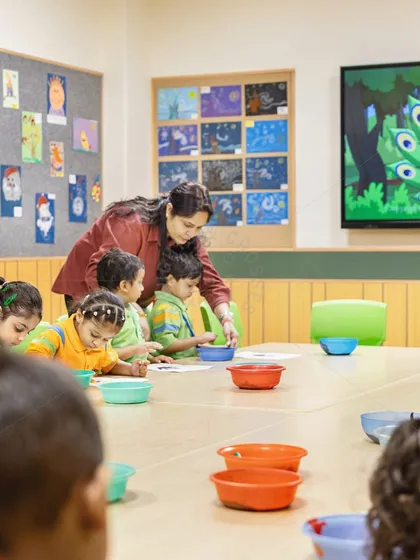 Young students engaged in an art activity at GD Goenka Public School. We design classrooms to be hands-on environments where creativity is encouraged, with ample space for group work and displaying student creations.