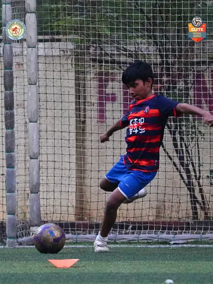 A young striker focuses on goal, captured at the moment of impact. Our events provide the perfect stage for players to showcase their shooting skills.