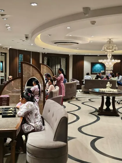 Inside KR Sons, the design responds to the cultural mode of jewellery shopping, which is often communal and conversational. The layout is divided into subtle silos using framed cane partitions, allowing families to have considered discussions with a blend of privacy and openness.