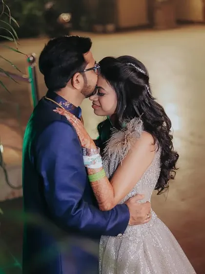 A quiet moment of affection amidst the celebration. A forehead kiss is a timeless expression of love that I always look to capture.
