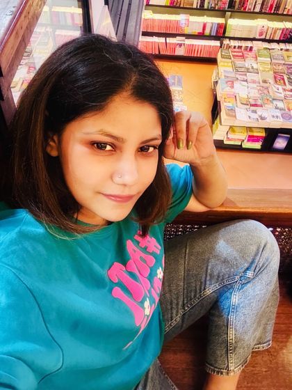 Relaxing in one of my favorite places, a bookstore cafe. A comfortable graphic tee and jeans are my uniform for a day of reading and unwinding.