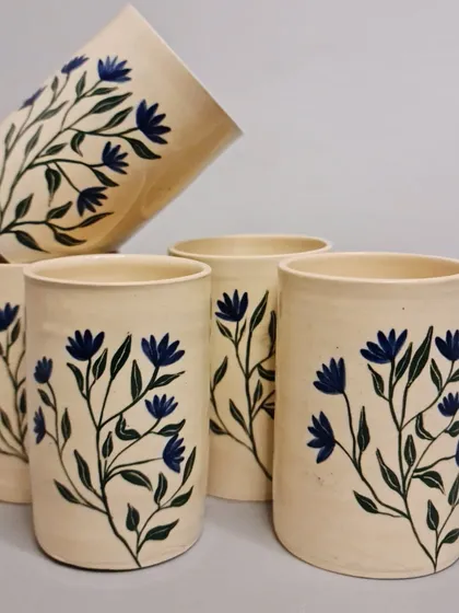 Discover the beauty of my handcrafted and hand-painted ceramic tumblers, featuring a delicate blue floral design. Each tumbler is lovingly crafted, ensuring a unique addition to your collection.