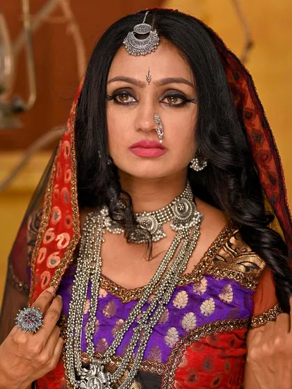 I love exploring different cultural styles. This portrait captures the vibrant, earthy essence of a Rajasthani folk look, complete with traditional silver jewellery and expressive makeup, showcasing my versatility.