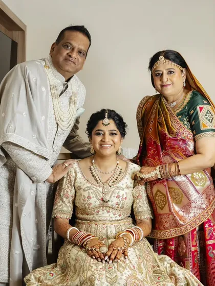 These heartwarming photos show the bride with her parents. I created coordinated, elegant makeup and hair for both the bride and her mother, ensuring everyone felt their best on this special family day.