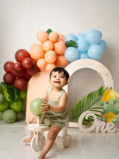 A huge smile from the birthday boy during his jungle-themed photoshoot. My goal is to create a fun atmosphere where genuine expressions like this can happen naturally.