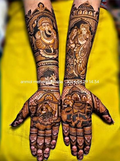A divine and regal design featuring a prominent Lord Ganesha on one arm and Radha-Krishna on the other. The palms are adorned with bride and groom figures.