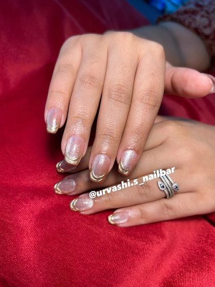 This collection showcases various cat-eye designs, from pink and gold glitter combinations to subtle shimmers with gold chrome tips. It highlights the versatility and enchanting effect of magnetic polishes.