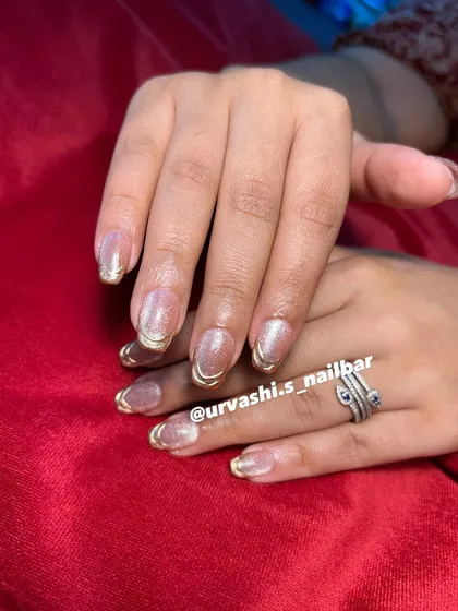 This collection showcases various cat-eye designs, from pink and gold glitter combinations to subtle shimmers with gold chrome tips. It highlights the versatility and enchanting effect of magnetic polishes.