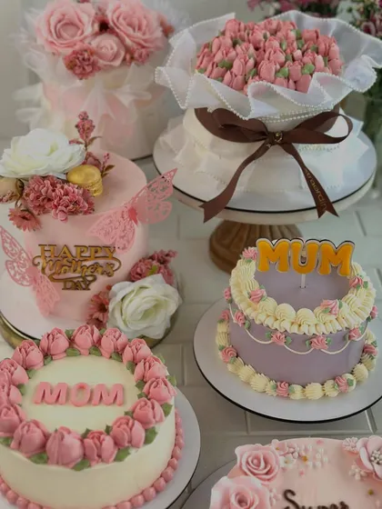 A beautiful spread of our Mother's Day cakes, featuring various floral designs, colors, and messages like "Mom," "Mum," and "Super Mom."