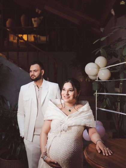 A beautifully captured, moody portrait of the parents-to-be. The lighting and composition give this photo a timeless and elegant feel.