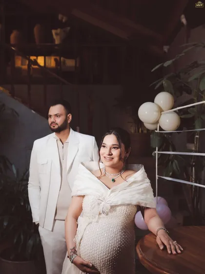 A beautifully captured, moody portrait of the parents-to-be. The lighting and composition give this photo a timeless and elegant feel.