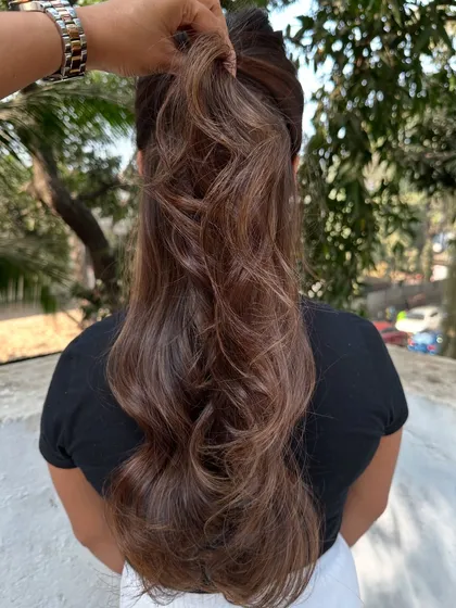 I call this look 'Hazelnut Chocolate Truffle'. It's a deep, rich brunette base with fine hazelnut highlights that add a subtle shimmer. This is a great option for anyone wanting to enhance their dark hair without a drastic change.